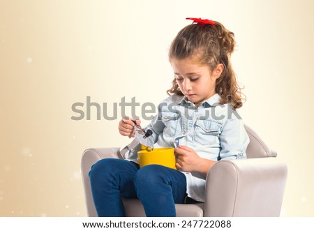 Blonde cute girl holding a cup of tea