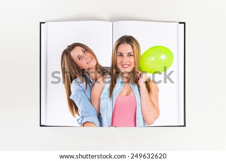 Friends with balloons printed on book