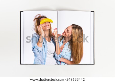 Friends playing with banana printed on book