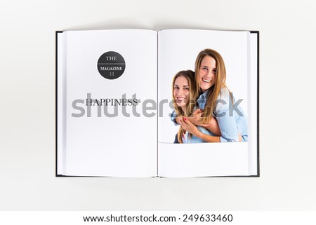 Sisters playing printed on book