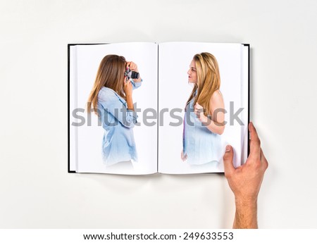 Girl photographing printed on book