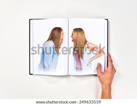 Girls doing a joke printed on book