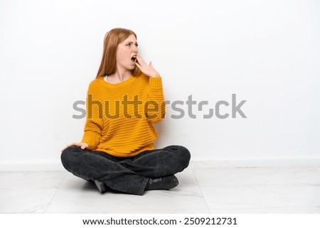 Similar – Image, Stock Photo Young redhead woman sit on grey linen fabric under orange coat with flowers and rowan berries