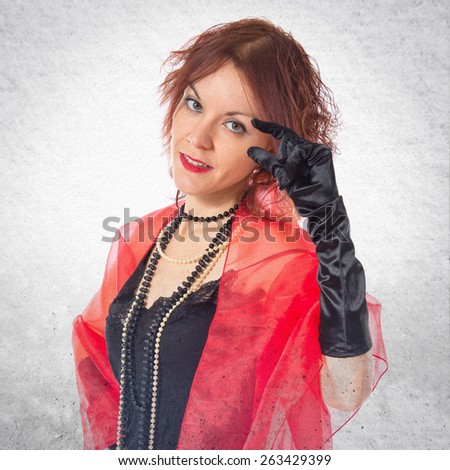 Woman in cabaret style doing tiny sign