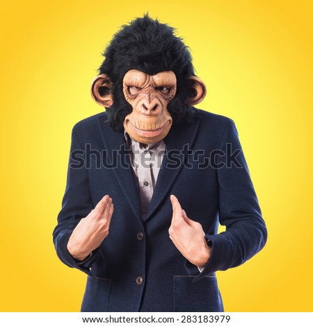 Monkey man doing surprise gesture over colorful background
