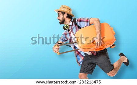 Tourist running fast over colorful background