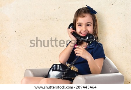 Girl talking to vintage phone
