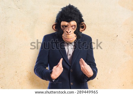 Monkey man doing surprise gesture over textured background