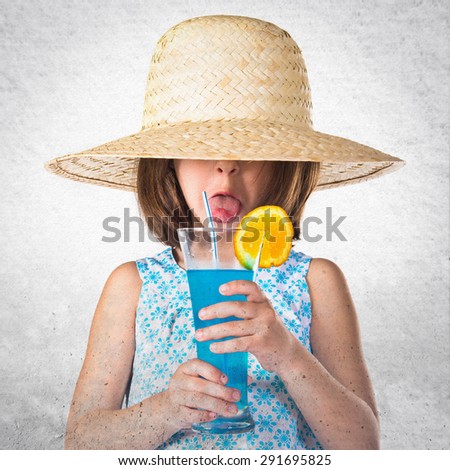 Girl drinking soda over grey background