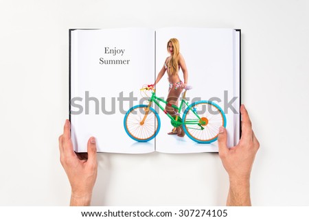Girl in bikini with colorful bike printed on book