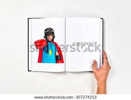 Girl dressed like superhero  printed on book