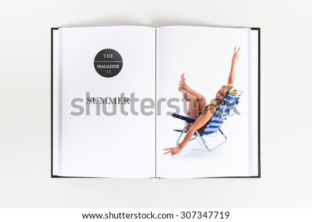 woman doing victory gesture printed on book