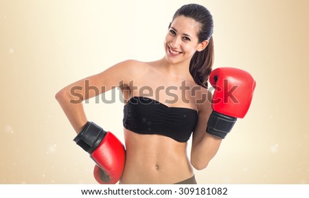 Happy sport woman with boxing gloves