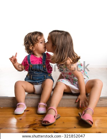Sisters kissing