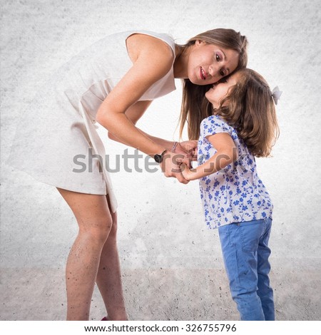 Woman whispering at her mother