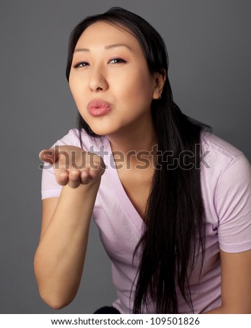 http://image.shutterstock.com/display_pic_with_logo/1100033/109501826/stock-photo-attractive-asian-woman-with-long-black-hair-shot-against-a-studio-background-109501826.jpg