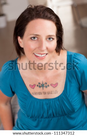 Beautiful woman with tattoo with the words: \
