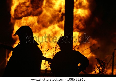KILKIS, GREECE - MAY 9: Fire-fighters train at extinguishing a fire on May 9, 2007 in Aspros Kilkis, Greece.