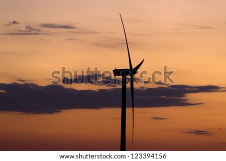 Wind turbine sunset background