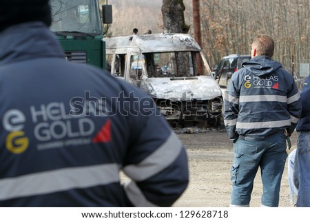 HALKIDIKI,GREECE-FEB 17:Group of 40 men threw molotov cocktails & set fire to equipment at the Hellenic Gold site, damaging containers, cars & trucks in the northern region of Halkidiki, Feb. 17, 2013