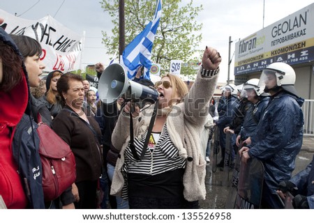 THESSALONIKI,GREECE-APR,14:Demonstrators shout slogans outside the police station during a protest against the arrest of residents for attacking a Canadian Eldorado Gold,in Thessaloniki,14 April 2013