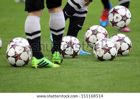 GELSENKIRCHEN, GERMANY -AUG 21: Adidas Champions League football balls during the training of PAOK on Aug 21,2013 in Gelsenkirchen, Germany.