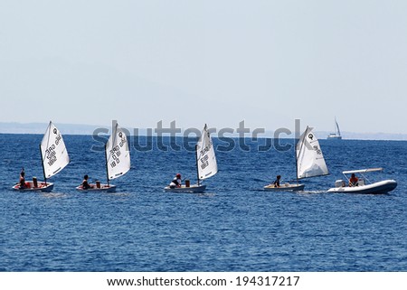 THESSALONIKI, GREECE- AUGUST 12, 2011: Offshore sailing school sailing with small boats, beginning their lesson and practicing onboard in Thessaloniki, Greece.