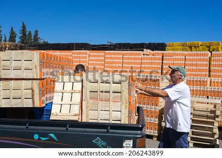NAOUSSA, GREECE- JULY 10, 2014: Products of Agricultural Cooperative of Naoussa, Greece, carried in boxes. The famous \