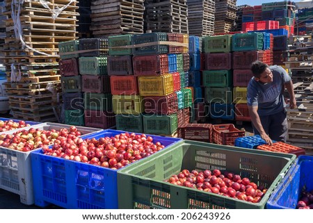 NAOUSSA, GREECE- JULY 10, 2014: Products of Agricultural Cooperative of Naoussa, Greece, stacked in crates. The famous \