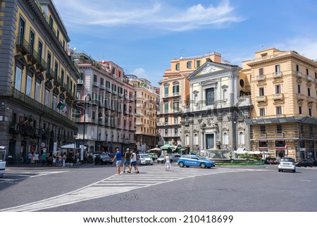 NAPLES, ITALY- AUGUST 3, 2014: Street view of Naples, Italy. Naples historic city centre is the largest in Europe, and is listed by UNESCO as a World Heritage Site.