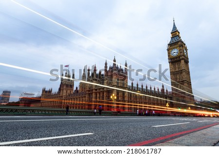 LONDON, UK- AUGUST 8, 2014: Big Ben and Houses of Parliament on Thames river. Big Ben tower, with 96.3 meters high, is the most important attraction of London. Long exposure.