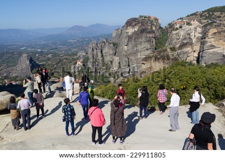 METEORS, GREECE - OCTOBER 12, 2014: Tourists taking pictures during their tour at Meteors, Greece.