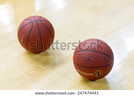 THESSALONIKI, GREECE - JAN 21, 2015: Basketball balls on the ground prior to the Eurocup game Paok vs Khimki in Paok Sports Arena.