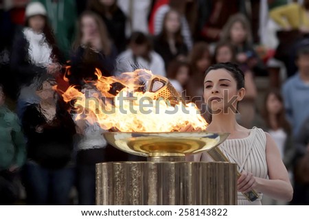 ATHENS,GREECE,OCT 5,2013:The Olympic flame was handed to organizers of the Sochi Winter Olympics 2014. The ceremony took place at the site of the first modern summer games, the Kallimarmaro Stadium