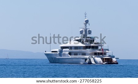 CHALKIDIKI, GREECE- AUGUST  16, 2014: Yacht in open sea in Chalkidiki, Greece. Yachts are very popular in Greece for transport in the ocean