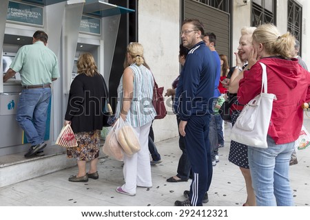 THESSALONIKI, GREECE,JULY 1 2015: People stand in a queue to use the ATMs of a bank. Greece\'s fraught bailout talks with its creditors took a dramatic turn, with the government announcing a referendum