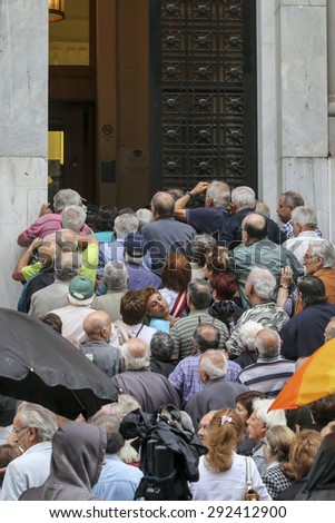 THESSALONIKI, GREECE, JULY, 1 2015: Pensioners queue outside a National Bank branch as banks only opened for the retired to allow them to cash up to 120 euros in Athens