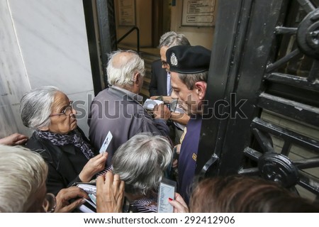 THESSALONIKI, GREECE, JULY, 1 2015: Pensioners queue outside a National Bank branch as banks only opened for the retired to allow them to cash up to 120 euros in Athens