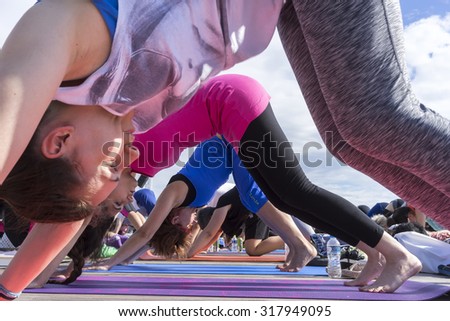 THESSALONIKI, GREECE - JUNE 21, 2015: Thessaloniki open yoga day. People gathered to perform yoga training during the day, outdoor activities
