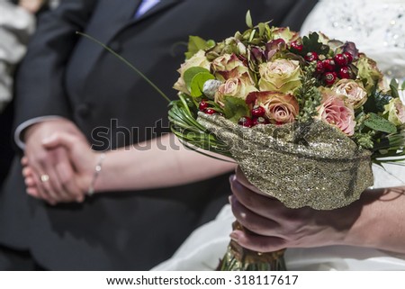 Beautiful wedding bouquet in hands of the bride