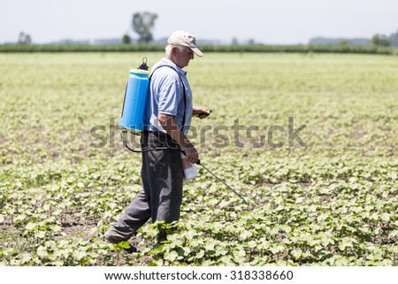 Thessaloniki, Greece - June 21, 2015: Farmer spraying cotton field in Greece.