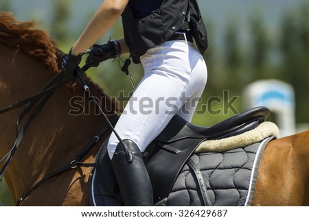 Thessloniki, Greece, June 14, 2015: Close up of the rider on a horse during competition matches riding round obstacles