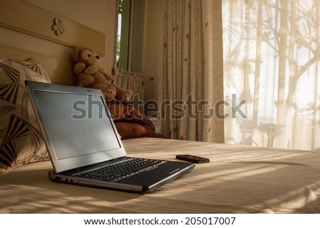 laptop on a bed, Technology