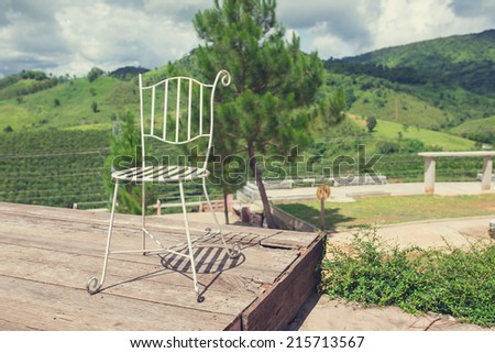 Chairs sitting by  mountain