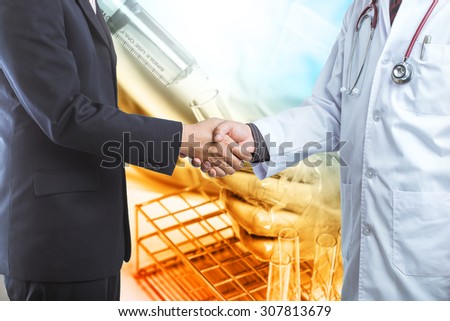 Businessman and doctor shaking hand\'s for some agreement