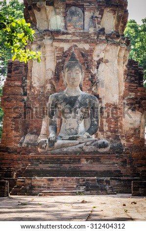 Asian religious architecture. Ancient sandstone sculpture of Buddha at Mahathat temple, Ayutthaya province, Thailand.\
Unseen Thailand / Historic City of Ayutthaya