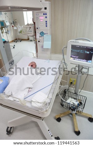 Newborn baby resting in hospital's post-delivery room