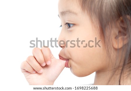 Closeup cute girl is sucking fingers on white background. Stockfoto © 