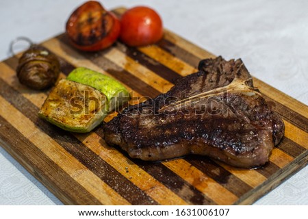 mouthwatering beef t-bone steak and grilled vegetables Photo stock © 