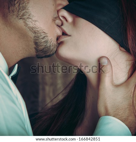 Couple in love kissing each others in studio